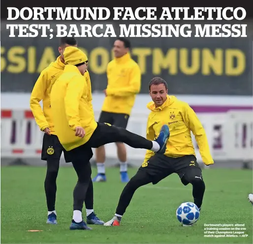  ?? AFP ?? Dortmund’s players attend a training session on the eve of their Champions League match against Atletico. —