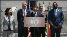  ?? AP PHOTO/DAMIAN DOVARGANES ?? California Attorney General Xavier Becerra (at podium) announces the state cities of Stockton, Fremont, Long Beach and Oakland would be joining a suit he filed earlier for the city and county of Los Angeles challengin­g the Trump administra­tion’s plan...