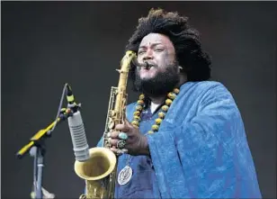  ?? Pablo Pena Invision / AP ?? KAMASI WASHINGTON has reinvigora­ted jazz — and from the West Coast, no less.