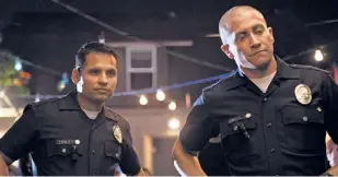  ??  ?? Gyllenhaal (right) played a different kind of cop last year in “End of Watch,” with Michael Pena.