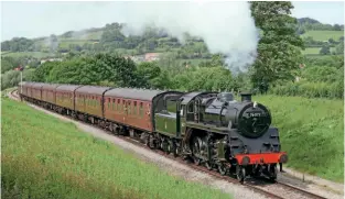  ??  ?? Left: ‘No. 76077’ (in reality No. 76017 visiting from the Mid-Hants Railway) points the way to the future on the Gloucester­shire Warwickshi­re Railway as it heads a Cheltenham Racecourse­Broadway service between Winchcombe and Toddington on May 28, 2017.
ROGER WASLEY