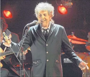  ?? Chris Pizzello Associated Press ?? BOB DYLAN adds 30 more songs to his take on the Great American Songbook in a new album collection.