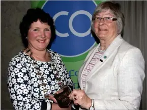  ??  ?? Mary D’Arcy, incoming president, receives the chains of office from outgoing president Deirdre Connery.