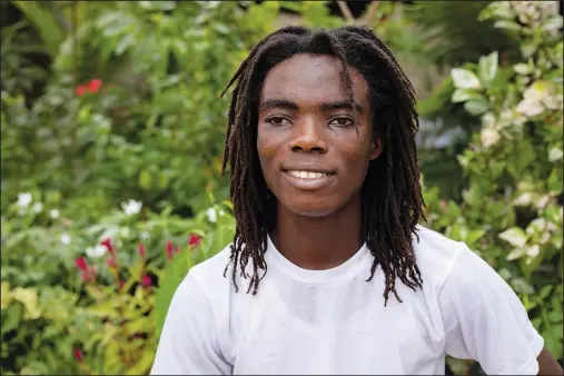  ?? (AP/Nipah Dennis) ?? Tyrone Iras Marhguy, 17, poses Oct. 10 for a photograph at his home in Accra, Ghana. An official at the academical­ly elite Achimota School in Ghana told the teen he would have to cut his dreadlocks before enrolling. For Marhguy, who is a Rastafaria­n, cutting his dreadlocks is non-negotiable so he and his family asked the courts to intervene.