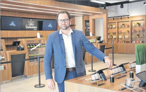  ?? STU NEATBY/THE GUARDIAN ?? Zach Currie, director of operations for the P.E.I. Cannabis Management Corporatio­n, takes questions from reporters during a tour of the P.E.I. Cannabis retail store on Belvedere Avenue on Monday. The store will open its doors Wednesday.