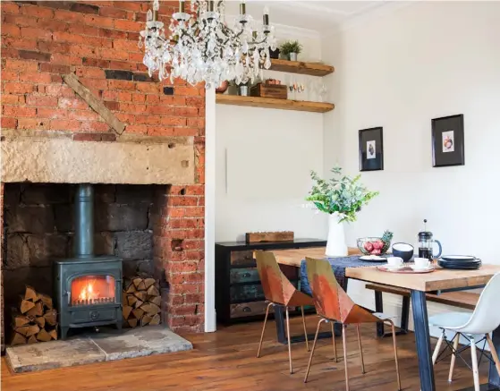  ??  ?? DINING SPACE A striking brick fireplace makes a warm backdrop in the kitchen-diner. Lucy and Alex chose a Calia table and bench from John Lewis & Partners, then treated themselves to a couple of Blue Dot Real Good Chair copper chairs from Heal’s, teamed with less expensive Eames-style seating from Ebay. The Portobello drawers are from Barker & Stonehouse LIVING ROOM Lucy loves the strong splashes of colour in this chill-out area, which include a Ritchie sofa from Made and, in the alcove, an artwork, Sardines from Lane By Post. Down Pipe from Farrow & Ball brings impact on the chimney breast