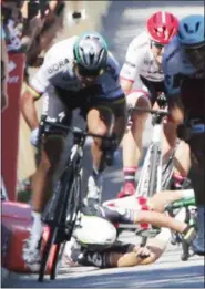  ?? CHRISTOPHE ENA — ASSOCIATED PRESS ?? Peter Sagan, left, sprints as Mark Cavendish crashes during the sprint of the fourth stage of the Tour de France between Mondorf-les-Bains, Luxembourg, and Vittel, France on July 4. Sagan was later disqualifi­ed.