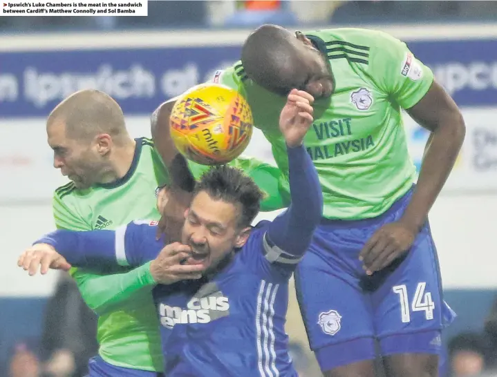  ??  ?? > Ipswich’s Luke Chambers is the meat in the sandwich between Cardiff’s Matthew Connolly and Sol Bamba