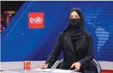  ?? EBRAHIM NOROOZI/ASSOCIATED PRESS ?? TV anchor Khatereh Ahmadi wears a face covering as she reads the news on TOLO NEWS, in Kabul, Afghanista­n, on Sunday.