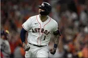  ?? DAVID J. PHILLIP — THE ASSOCIATED PRESS ?? The Astros’ Carlos Correa celebrates a home run against the Red Sox during the seventh inning in Game 1 of the American League Championsh­ip Series Friday in Houston.