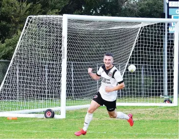  ??  ?? Henri Scott smiles after scoring for Warragul United against Casey Comets in Saturday’s soccer action.