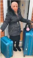  ??  ?? Sabeena Dhalla with her luggage at her mum’s home in Leicester yesterday.