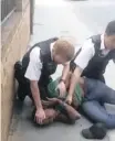  ?? | AP ?? A VIDEO image provided by @Realairavi­sh, of police kneeling on Marcus Coutain’s neck during an arrest in north London.