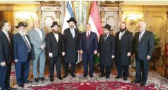  ?? (Courtesy) ?? ASHKENAZI CHIEF RABBI David Lau (in front of Israeli flag) meets with Hungarian Prime Minister Viktor Orban (to right of Lau) together with other Jewish leaders, including Rabbi Menachem Margolin, director-general of the Rabbinical Center of Europe...