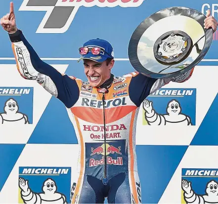  ??  ?? I feel like a superhero: Honda’s Marc Marquez celebratin­g on the podium after winning the Australian MotoGP at Phillip Island yesterday. — AFP