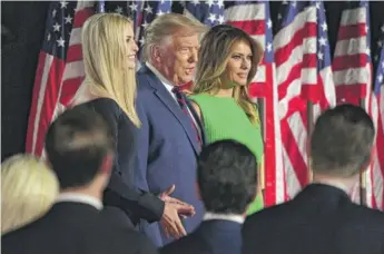  ?? SAUL LOEB/AFP VIA GETTY IMAGES ?? President Donald Trump is flanked by daughter Ivanka Trump and first lady Melania Trump after arriving to deliver his Republican acceptance speech on Thursday.