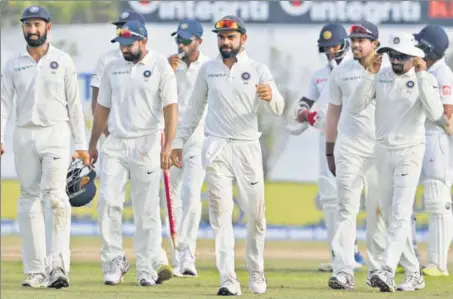  ??  ?? It was business as usual with Virat Kohli (centre) producing another classy knock to carry India to victory in four days at a venue where Sri Lanka have ruled the roost.
