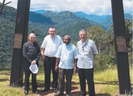  ?? MOVING MOMENT: Fr Rod Ward, Bishop Tim Harris, Cardinal Sir John Ribat and Fr Ben Flemming at Owers’ Corner on the Kokoda Trail. ??