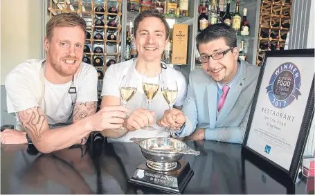  ?? Picture: Angus Findlay. ?? Graeme Pallister, centre, celebrates 63 Tay Street’s success with left , chef Lee Steele and right, manager Lukas Richly.