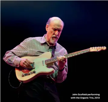  ??  ?? John Scofield performing with the Organic Trio, 2013