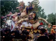  ??  ?? Balinese giant effigy locally known as “ogohogoh”, that represents evil spirits, line up during a parade to celebrate Nyepi, the annual day of silence marking Balinese Hindu new year in Bali, Indonesia, on Thursday.