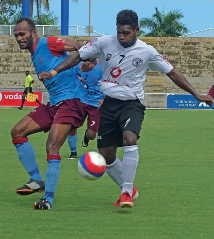  ?? Photo: Simione Haravanua ?? Suva’s Gagame Feni (7) battles for possession against Nasoni Mereke in the Vodafone Premier League in Suva on February 17, 2019.