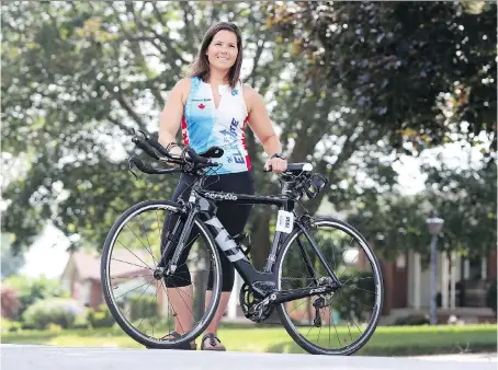  ?? PHOTOS: JASON KRYK ?? Triathlete Nikki LeBlanc completed the Ironman Ohio 70.3-mile race in 5:46:40, placing her seventh in her age category. Ironman 70.3 athletes swim 1.9 km, bike 90 km and then run a half marathon, which is 21.1 km.