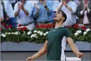  ?? PAUL WHITE - THE ASSOCIATED PRESS ?? Carlos Alcaraz celebrates after winning the final match against Alexander Zverev at the Mutua Madrid Open in Madrid, Spain on Sunday.