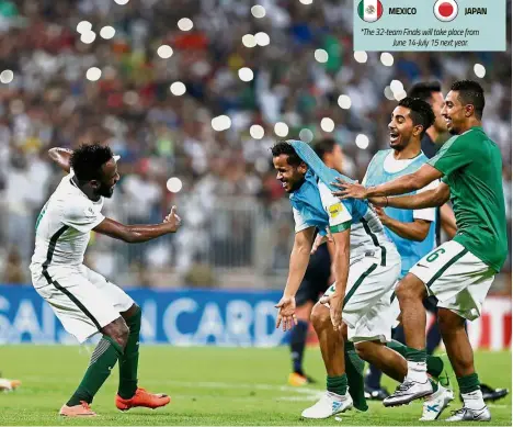  ?? — Reuters ?? Untold joy: The Saudi Arabia players celebrate after their 1- 0 win over Japan in Jeddah on Tuesday. Saudi Arabia are through to next year’s World Cup Finals in Russia.