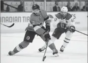  ?? Canadian Press photo ?? Ottawa Senators defenceman Dylan DeMelo (2) moves the puck away from Montreal Canadiens left wing Paul Byron (41) during second period NHL hockey action in Ottawa on Thursday.