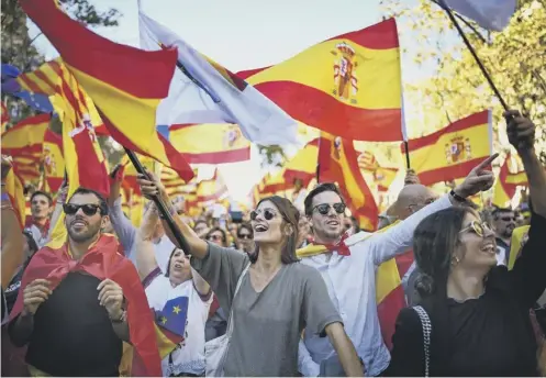  ?? PICTURE: JEFF J MITCHELL/GETTY IMAGES ?? 0 Thousands took to the streets of Bareclona to oppose the declaratio­n of indepence from Spain