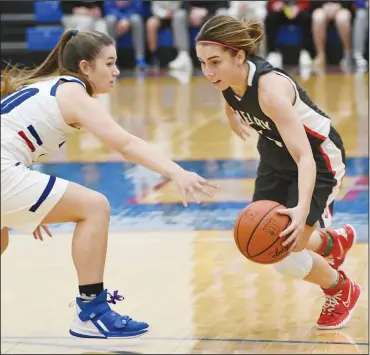  ?? CHUCK RIDENOUR/SDG Newspapers ?? Shelby’s Sophia Niese works around a Highland defender during a recent contest. The Lady Whippets (9-0) have a pair of contests this week to close out the 2021 portion of the schedule. Tuesday the SHS girls travel to the Cedar Point Sports Center to face unbeaten Garfield Heights Trinity (5-0) in the Jingle Bell Jam at 2:15 p.m. Thursday evening the leaders of the Mid Ohio Athletic Conference travel to Clear Fork for a key contest.