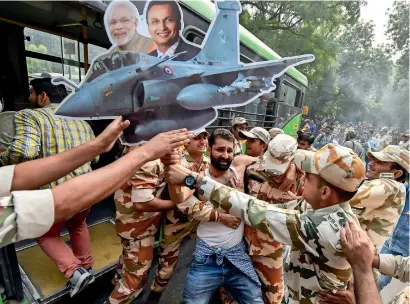  ?? PTI ?? Indian youth Congress members stage a protest against the government over the rafale fighter jet deal in new Delhi on friday. —