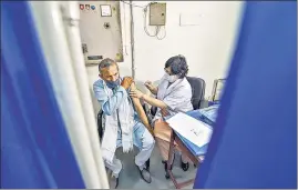  ??  ?? A medic administer­s a Covid-19 vaccine to an elderly person in New Delhi, on March 1.