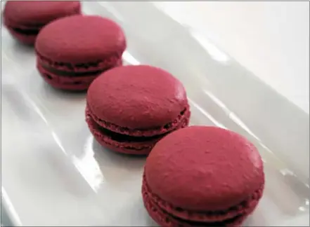  ?? PHOTO BY EMILY RYAN ?? These French macarons from General Warren feature milk chocolate ganache.