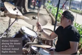  ??  ?? Manny Salvador playing the drums at the 2018 National Animal Rights March.