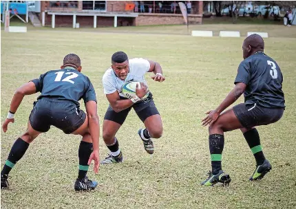  ?? Picture: SUPPLIED ?? CONGRATULA­TIONS: Talented Sesetu Mpaka of Queen’s College (in black and white), displaying explosive speed and power, made the selection for the SA U18A rugby team and is set to face France and England in the internatio­nal series in the Western Cape