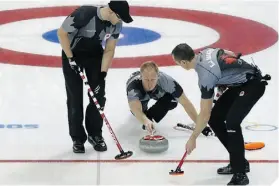 ?? ADRIAN DENNIS/AFP/GETTY IMAGES ?? PRESSURE Skip Brad Jacobs throws a stone during a loss to Sweden.