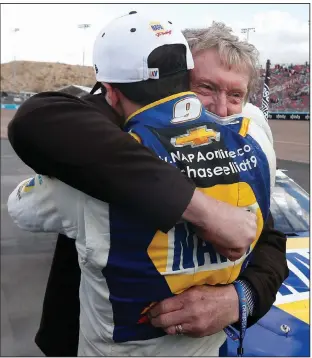  ?? (AP/Ralph Freso) ?? Chase Elliott gets a hug from his father Bill Elliott on Sunday after Chase Elliott won Sunday’s race at Phoenix Raceway and clinched his first NASCAR Cup Series championsh­ip. Bill Elliott, a NASCAR Hall of Famer, won the championsh­ip in 1988.