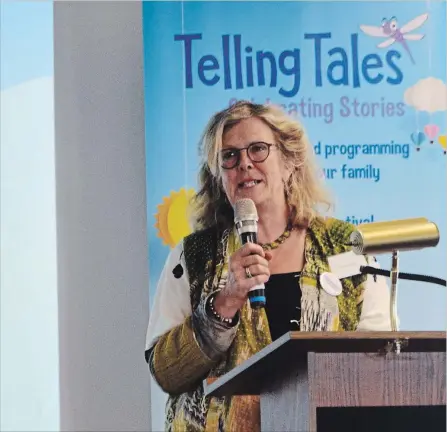  ?? MAC CHRISTIE/METROLAND MAC CHRISTIE/METROLAND ?? Telling Tales founder Susan Jasper speaks at Hamilton’s Central Library about the 10th annual children’s literary festival. This year's event, taking place Sept. 16 at Westfield Heritage Village, will include Dennis Lee, Eric Walters, David Bouchard...