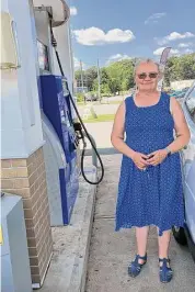  ?? Liese Klein/Connecticu­t Hearst Media ?? Helen Werns, of Wallingfor­d, noticed an increase in gas prices after heat and OPEC supply cuts affected fuel costs statewide.