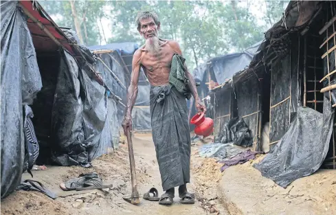  ?? AP ?? An elderly displaced Rohingya man walks in a makeshift refugee camp in Cox’s Bazar, Bangladesh on Tuesday.