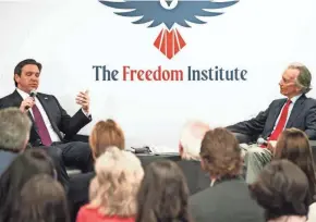  ?? JONAH HINEBAUGH/NAPLES DAILY NEWS/USA TODAY NETWORK-FLORIDA ?? Gov. Ron DeSantis, left, speaks with Tom Grady at The Freedom Institute of Collier County in Naples on Wednesday.