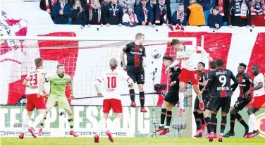 ?? Reuters ?? ↑
Leipzig’s Patrik Schick ( fifth right) scores a goal against Bayer Leverkusen during their during German League match on Sunday.