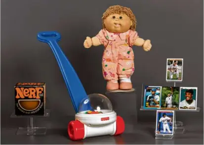  ?? NATIONAL TOY HALL OF FAME VIA AP ?? The newest additions to the Toy Hall of Fame (from left): NERF toys, the Fisher-Price Corn Popper, Cabbage Patch Kids dolls, and baseball cards.