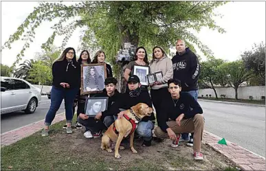  ?? PHOTOS BY ALEX HORVATH / THE CALIFORNIA­N ?? Mariah Salinas, Alicia Wilson, Angela Wilson, Landon Hutchings, Vincent Hutchings, Alice Hutchings, Bennett Johnson, and Sasha and Steven McKeen gather at Brimhall Road just east of Old Farm Road. The families and friends of Devin Atha, Timothy Wilson and Andrew Ortiz, three 20-year-olds who died in a car crash on New Year’s Eve, want a memorial to be placed at Brimhall Road, the site of the crash, and at The Park at River Walk.