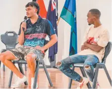  ?? ?? Former students Krystian Bevan (Mossman) and Eli Taylor (Doomadgee) speak to the graduates about life after NRL Cowboys House.