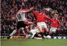  ?? Photograph: Peter Bennett/Action Images ?? Ole Gunnar Solskjaer shoots past Jamie Carragher for the winner in injury time in the FA Cup fourth round in January 1999.