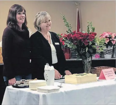  ?? SPECIAL TO THE EXAMINER ?? Bev Matthews, former mayor, was honoured at a gathering of politician­s, friends and residents of Trent Lakes at the Municipal offices on Nov. 30. Kari Stevenson, municipal clerk, pictured with Matthews, shared her memories and presented 24 roses for Matthews’ 24 years in municipal government.