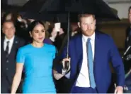  ?? AP PHOTO/ KIRSTY WIGGLESWOR­TH ?? Britain’s Prince Harry and Meghan, the Duke and Duchess of Sussex arrive at the annual Endeavour Fund Awards in London in March.